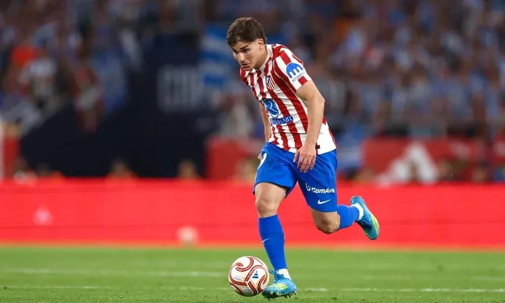 Player dribbling the ball on the field Player dribbling the ball on the field