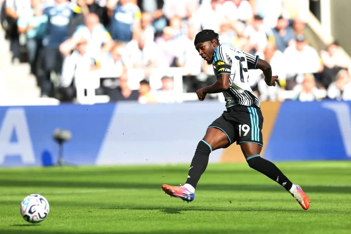 Player kicking the ball during a match Player kicking the ball during a match