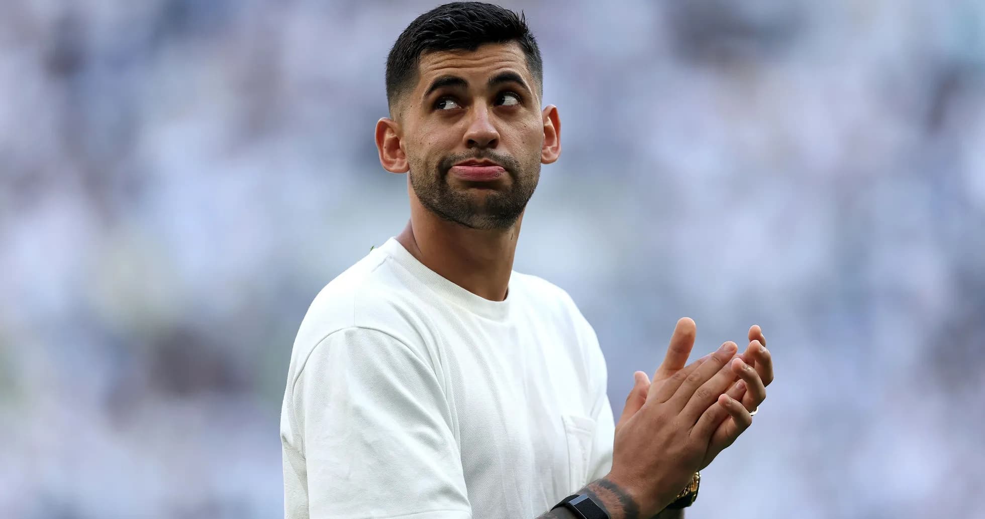 Player clapping in a stadium with fans Player clapping in a stadium with fans