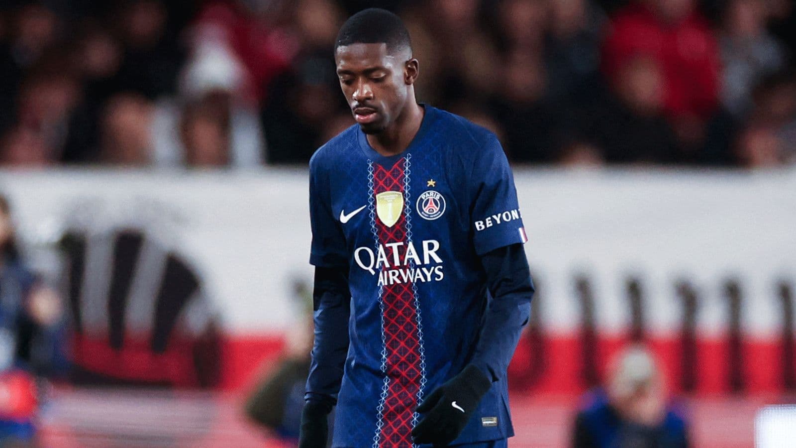 Player in PSG kit walking during match Player in PSG kit walking during match