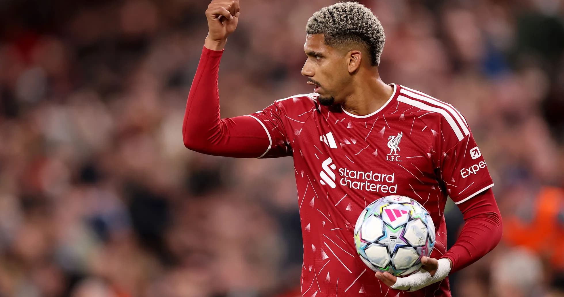 Player signaling while holding a football during match Player signaling while holding a football during match
