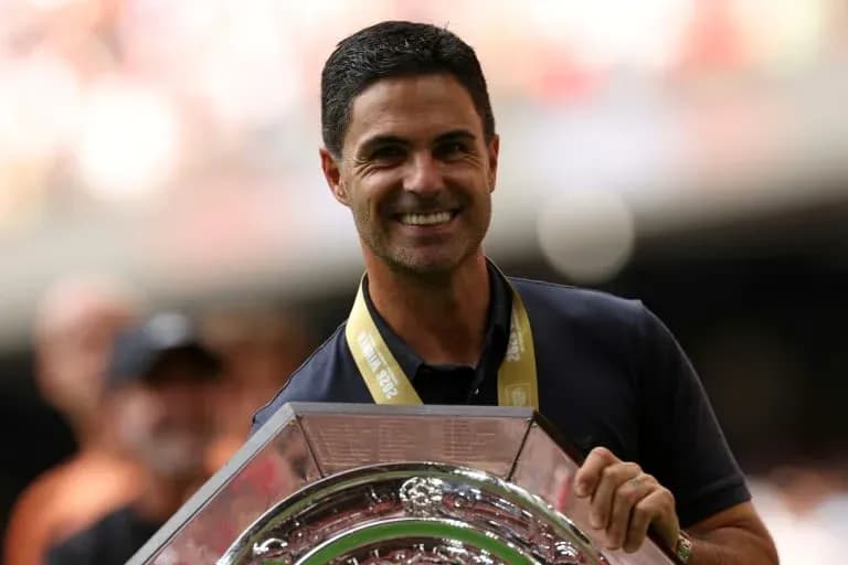 Manager holding trophy during celebration event Manager holding trophy during celebration event