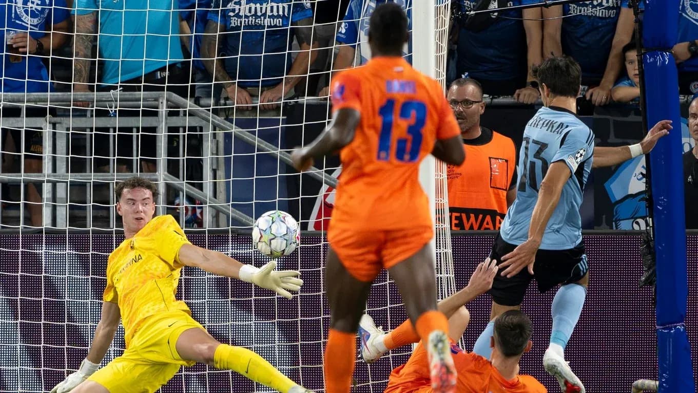 Goalkeeper making a save during UEFA match Goalkeeper making a save during UEFA match