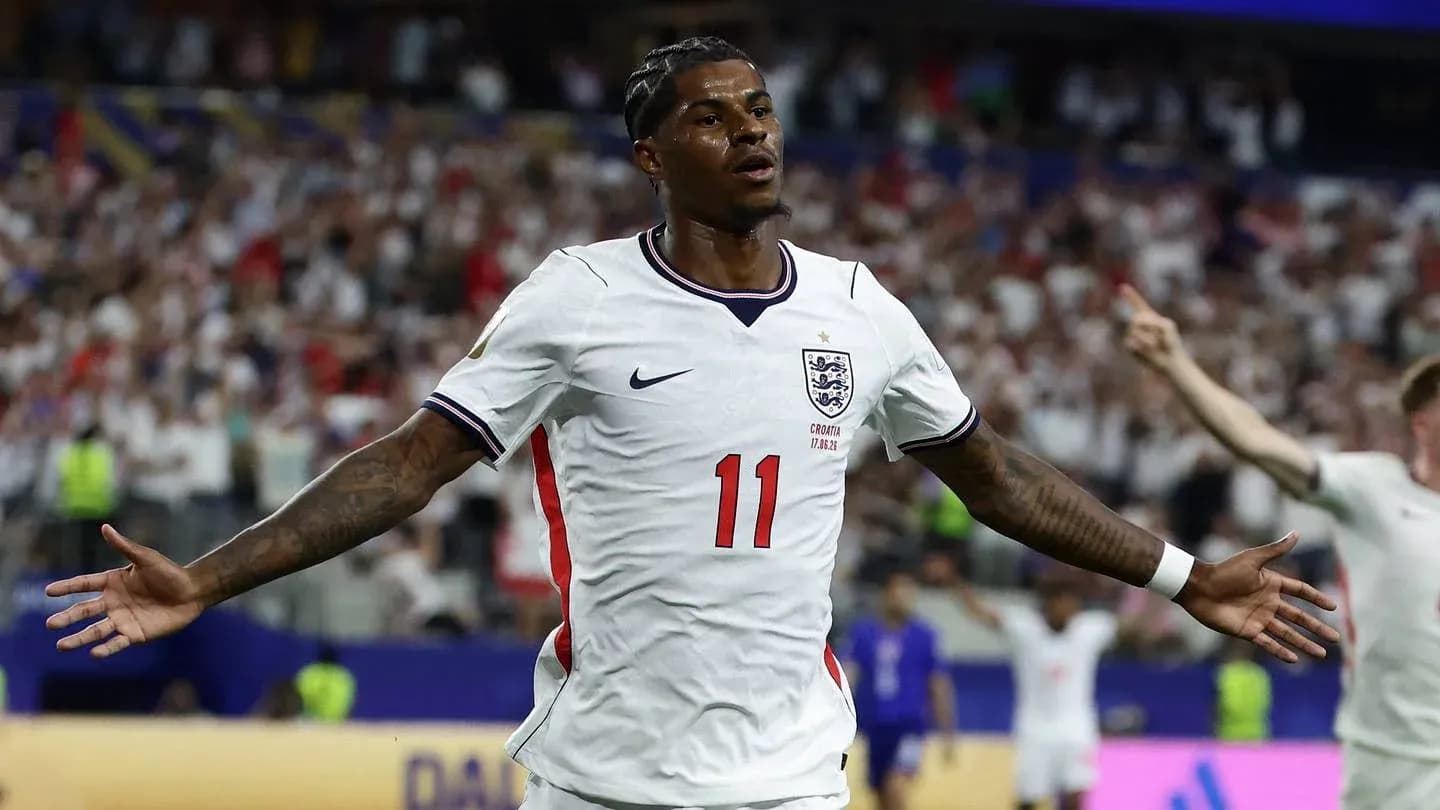 Player celebrating goal with arms outstretched Player celebrating goal with arms outstretched