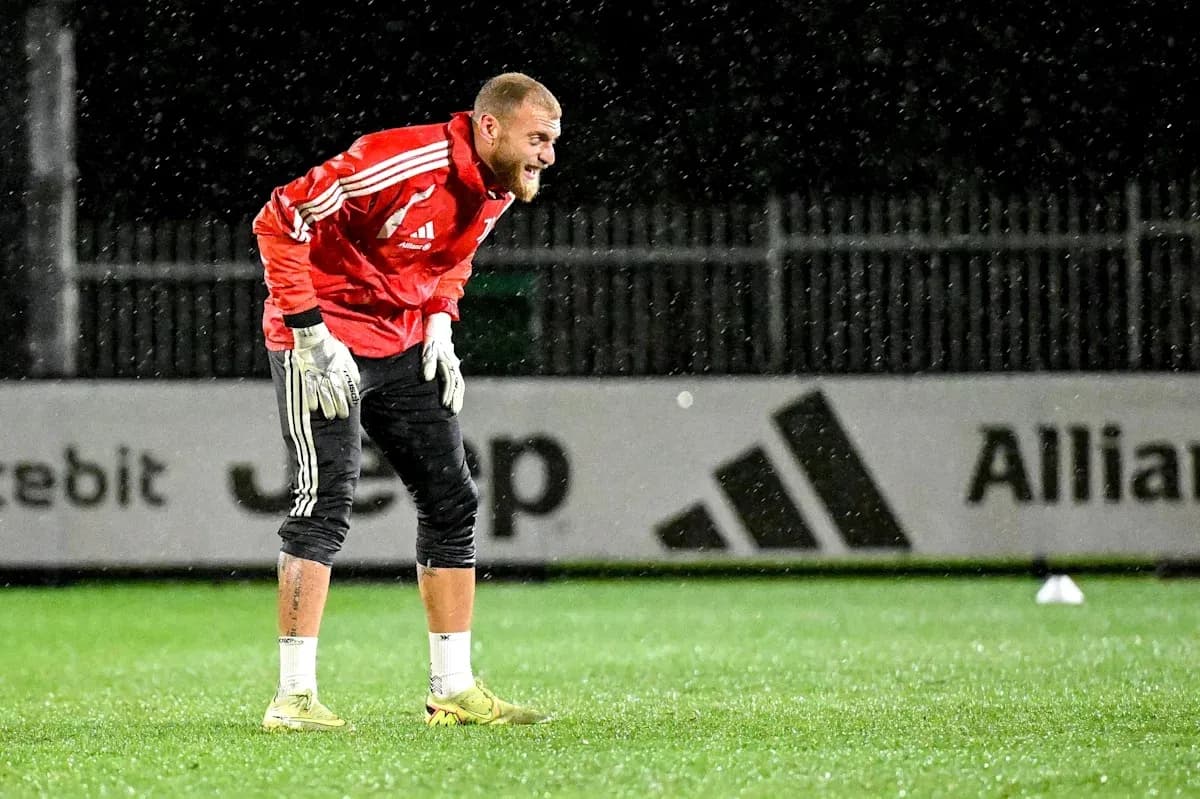 Goalkeeper training in the rain on pitch Goalkeeper training in the rain on pitch