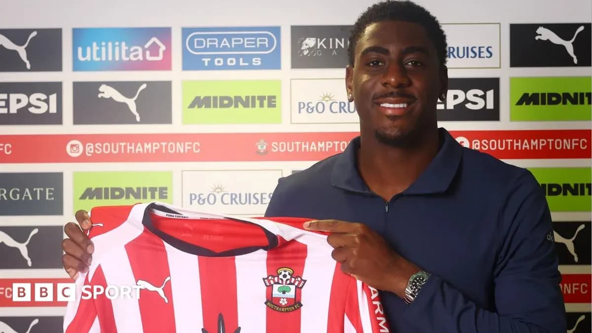 Player holding Southampton FC jersey during signing event Player holding Southampton FC jersey during signing event