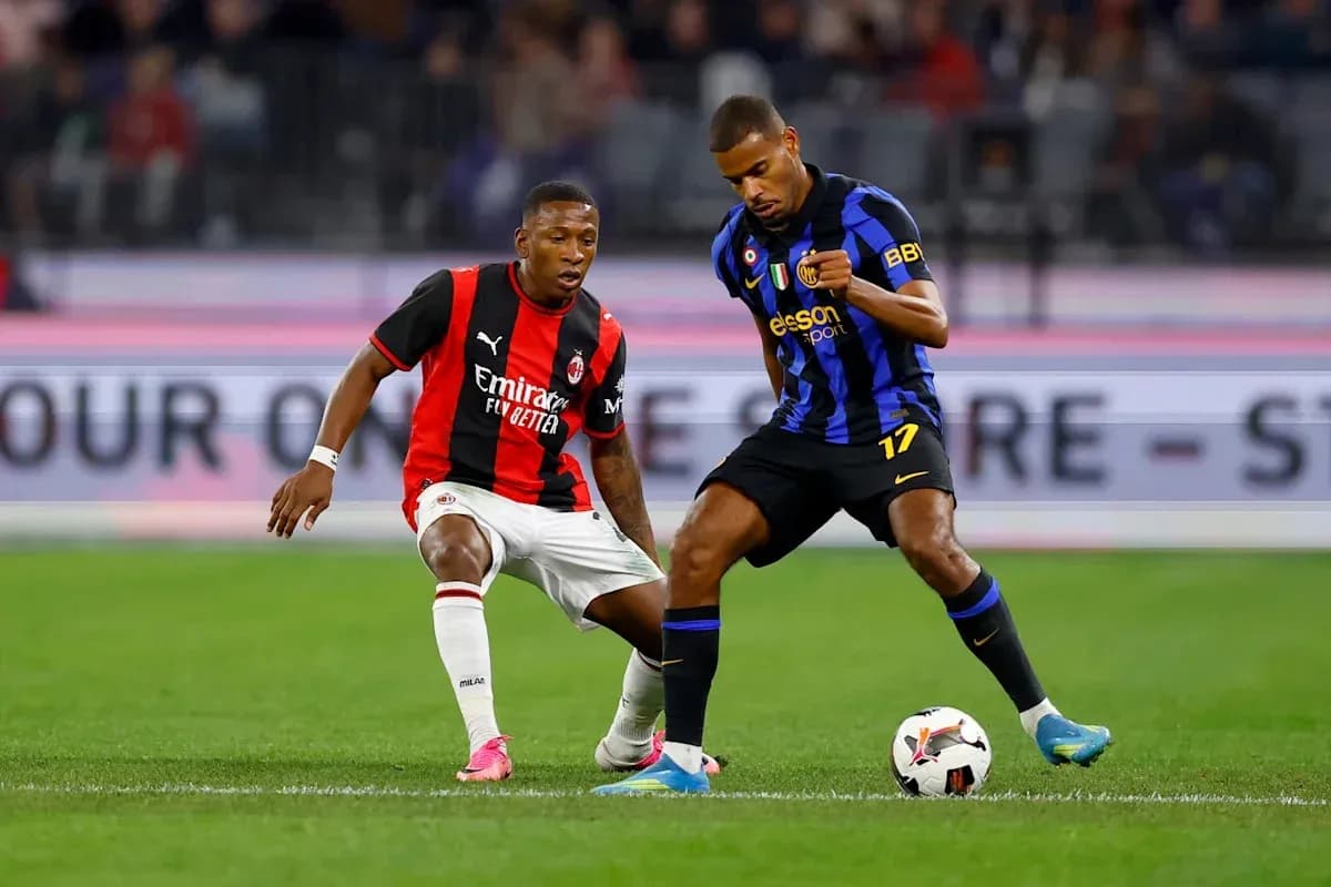 Two players contesting possession of the ball Two players contesting possession of the ball