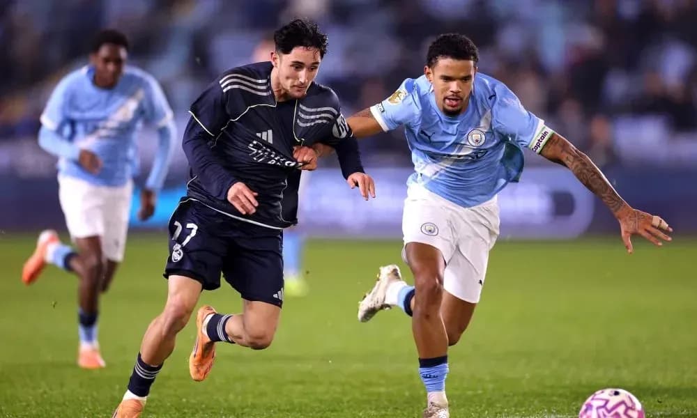 Real Madrid and Manchester City players competing for the ball Real Madrid and Manchester City players competing for the ball