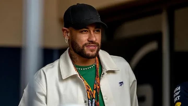 Man wearing a cap and jacket at event Man wearing a cap and jacket at event