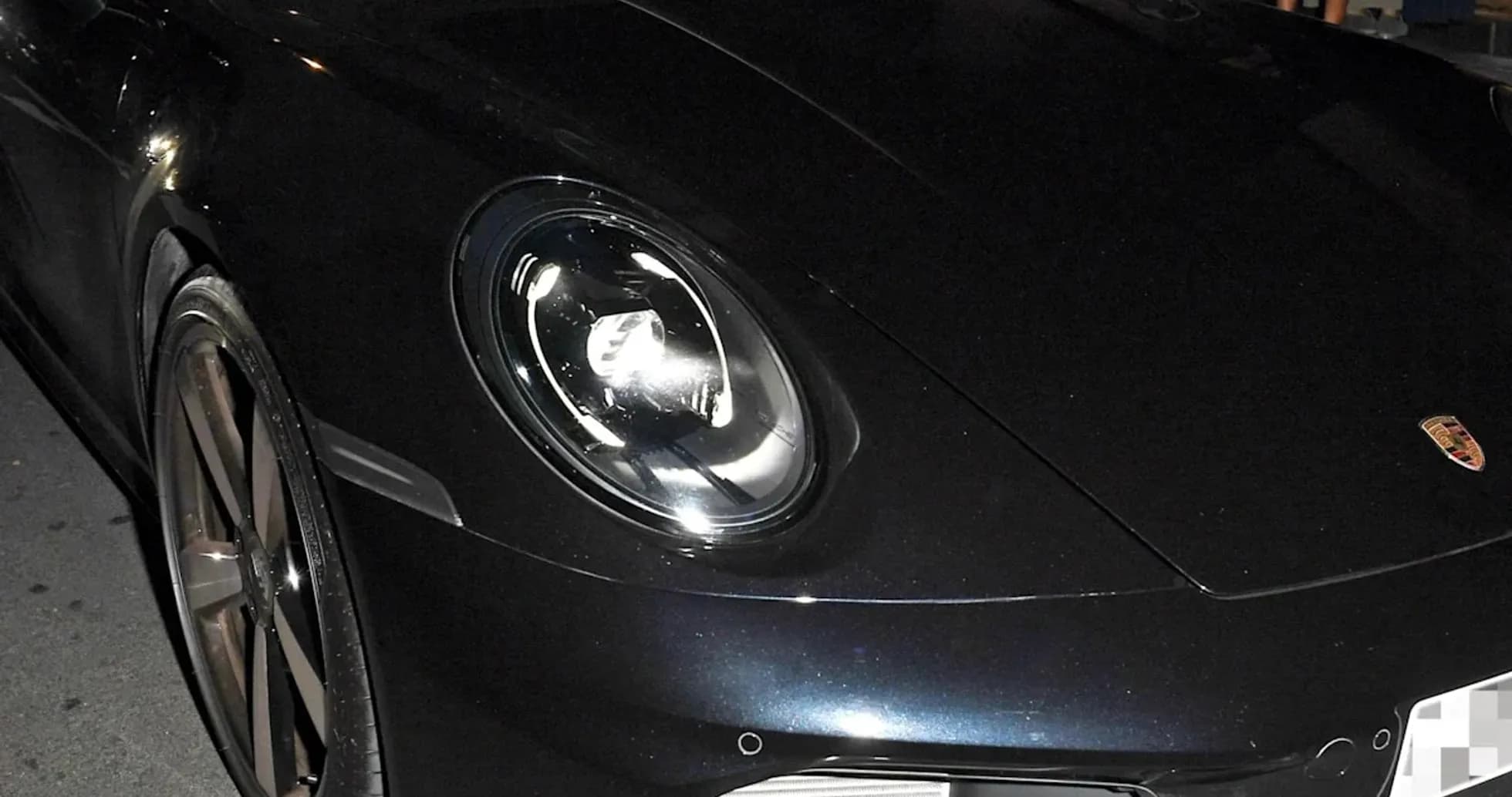 Two men inside a Porsche car at night Two men inside a Porsche car at night