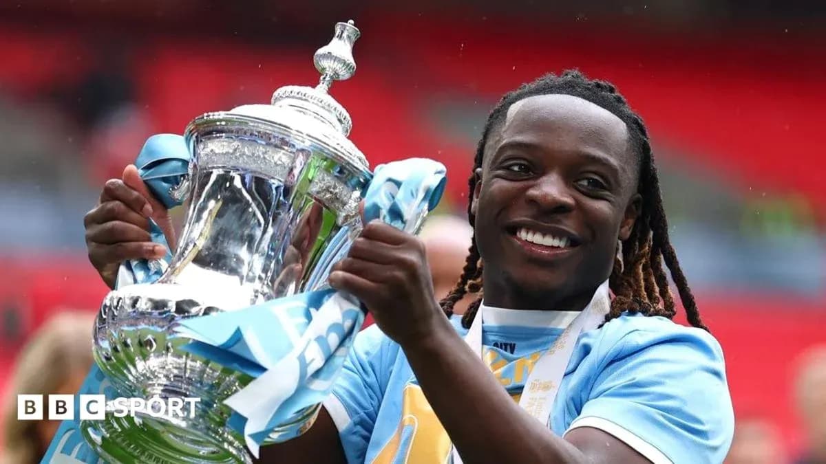 Player celebrating with trophy after match victory Player celebrating with trophy after match victory