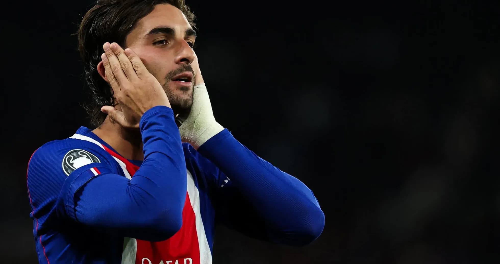 Player in blue jersey touching his face during match Player in blue jersey touching his face during match