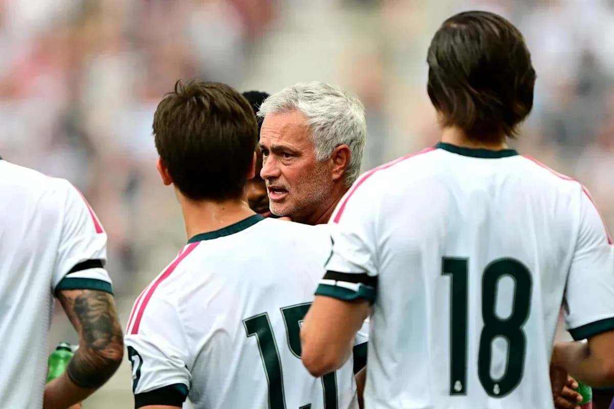 Coach discussing strategy with players during match Coach discussing strategy with players during match