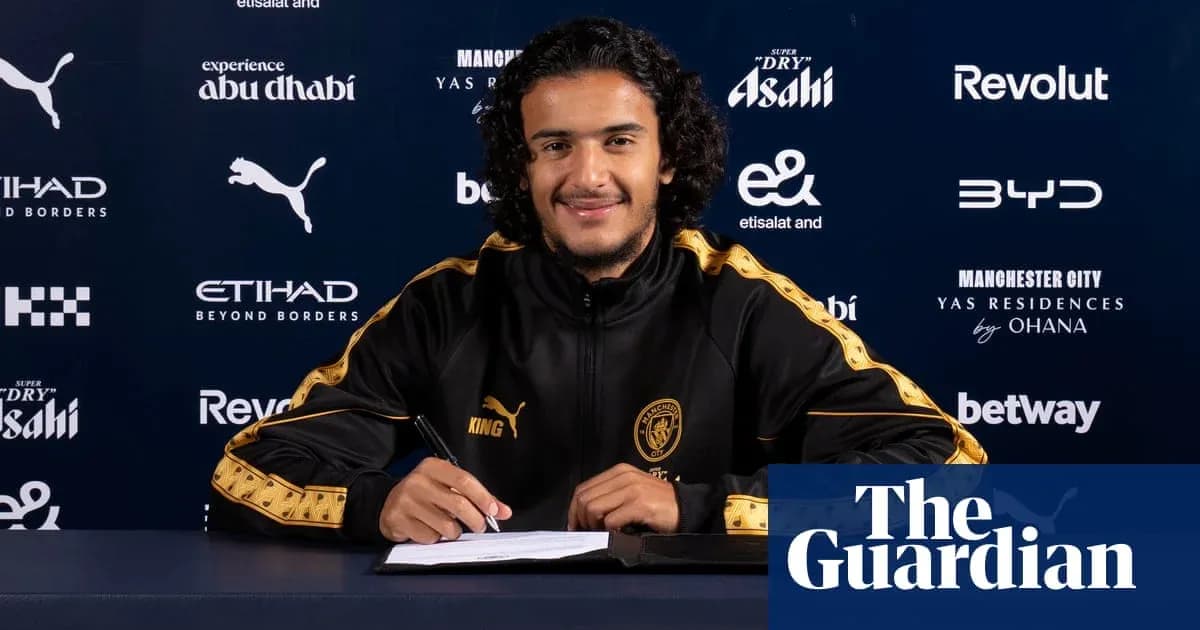 Player signing contract at Manchester City press event Player signing contract at Manchester City press event