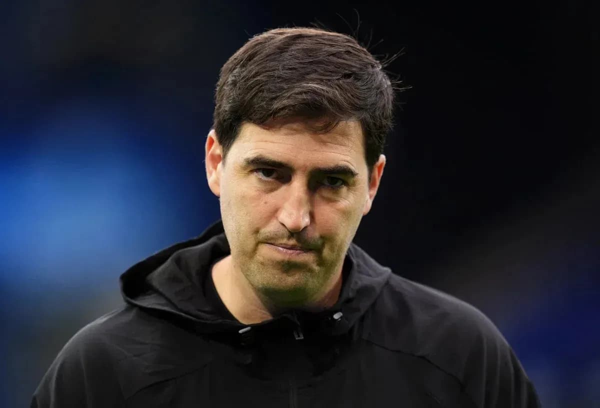Coach wearing black jacket during match preparations Coach wearing black jacket during match preparations