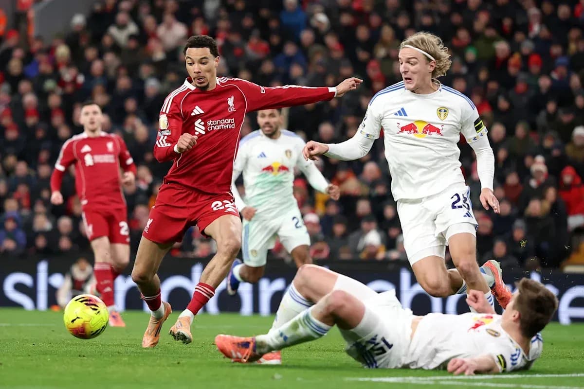 Liverpool and Leeds players contesting the ball on field Liverpool and Leeds players contesting the ball on field