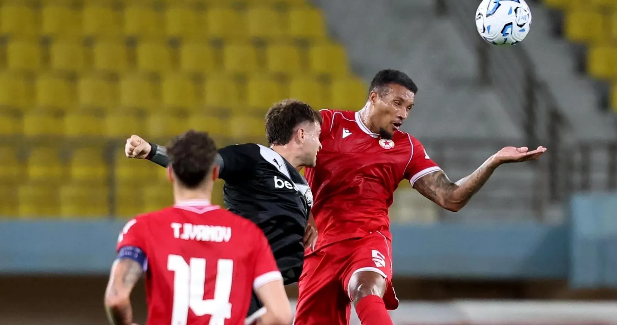 CSKA Sofia player challenging OFI player for the ball CSKA Sofia player challenging OFI player for the ball