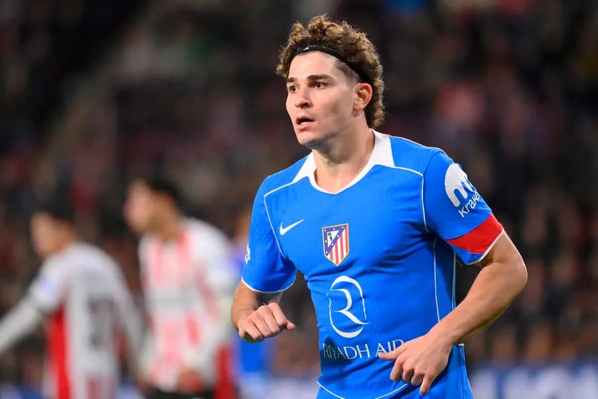 Player wearing blue Atletico Madrid jersey during match Player wearing blue Atletico Madrid jersey during match