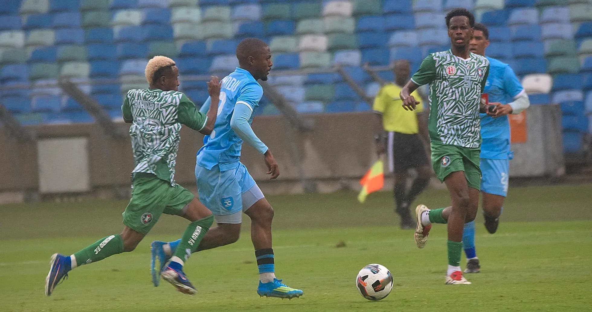 Players competing for the ball in CAF match Players competing for the ball in CAF match