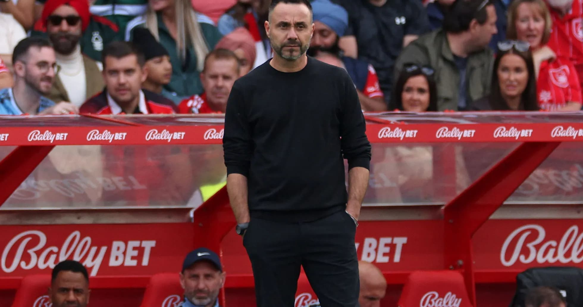 Manager standing on the sidelines during a match Manager standing on the sidelines during a match