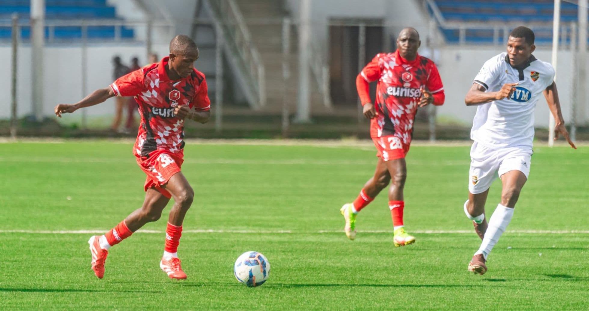 Kano Pillars player dribbling past Doma United defenders Kano Pillars player dribbling past Doma United defenders