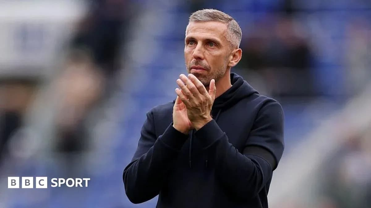 Coach applauding fans after a match Coach applauding fans after a match