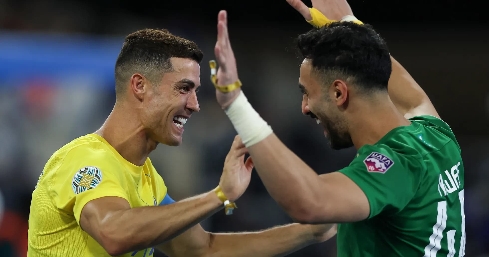 Two players celebrating together on the field Two players celebrating together on the field