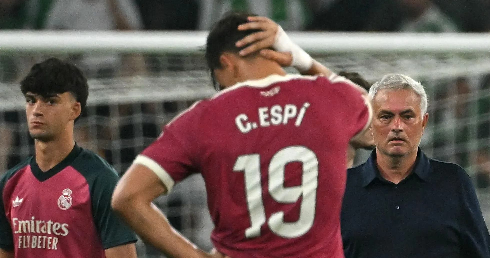 Players reacting after match with coach observing Players reacting after match with coach observing