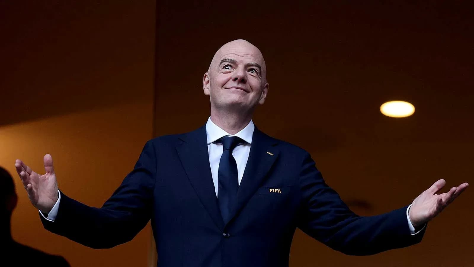 FIFA president gesturing at an event FIFA president gesturing at an event