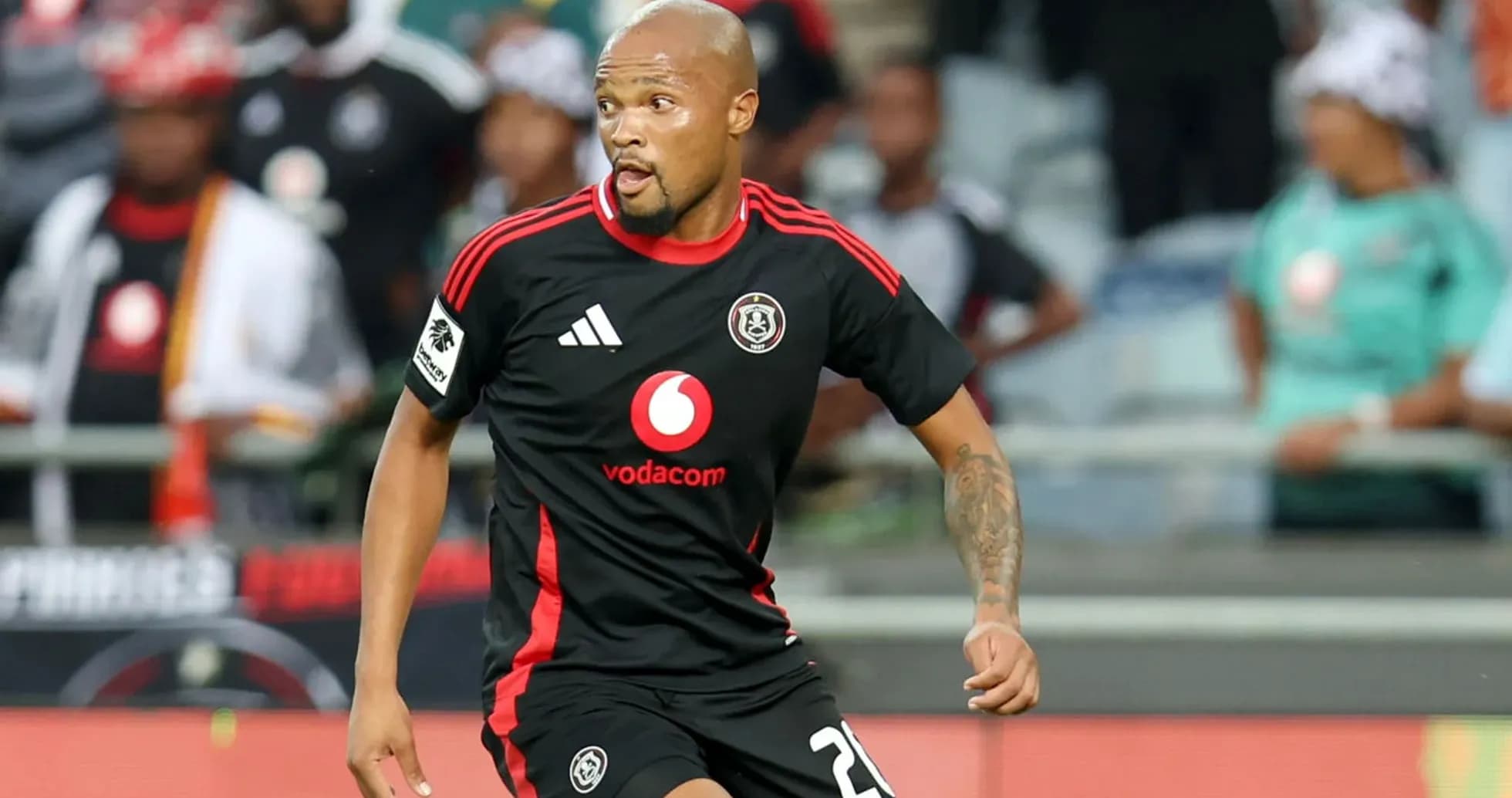Player in black jersey running during match Player in black jersey running during match
