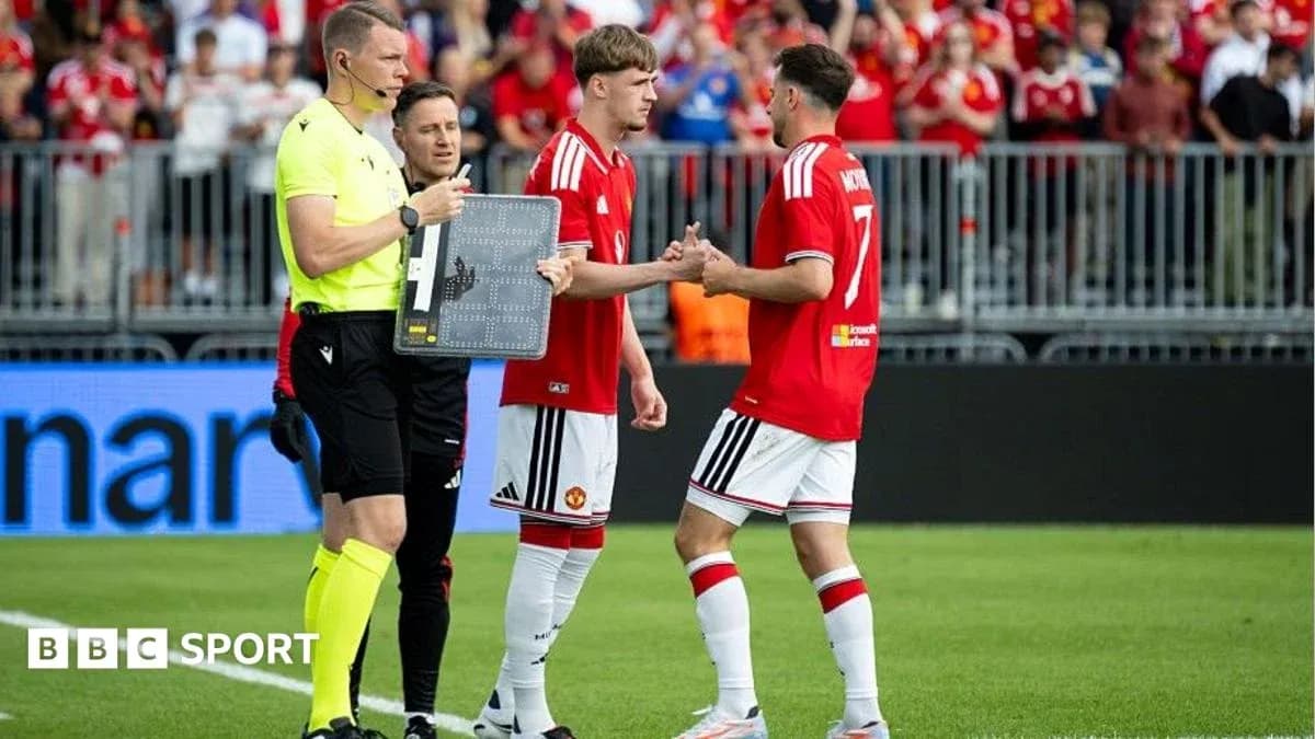 Players shaking hands during substitution in match Players shaking hands during substitution in match
