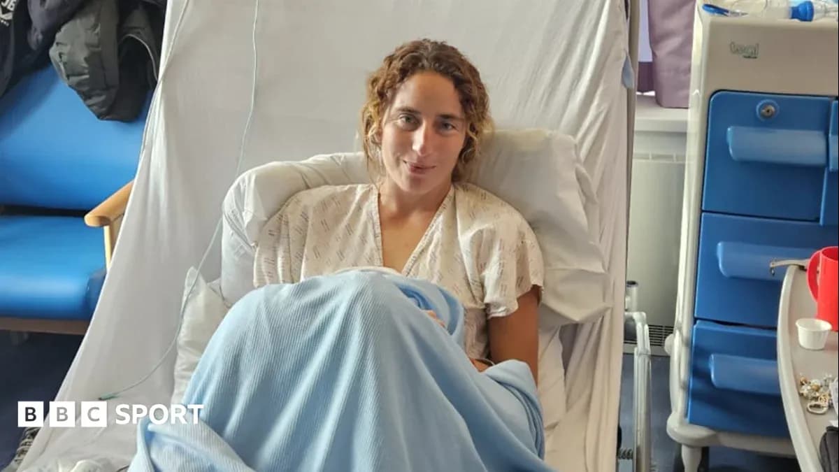 Athlete sitting in hospital bed with blanket Athlete sitting in hospital bed with blanket