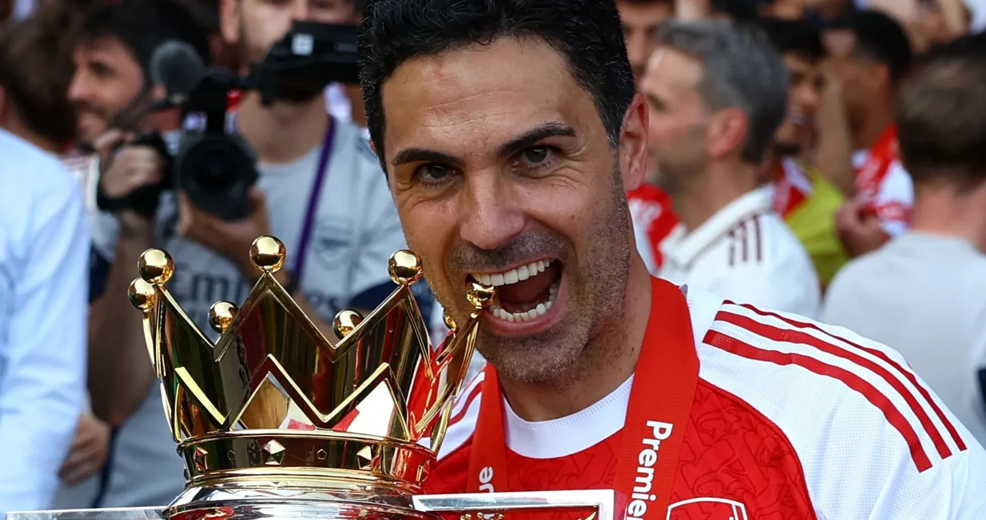 Coach celebrating with Premier League trophy Coach celebrating with Premier League trophy
