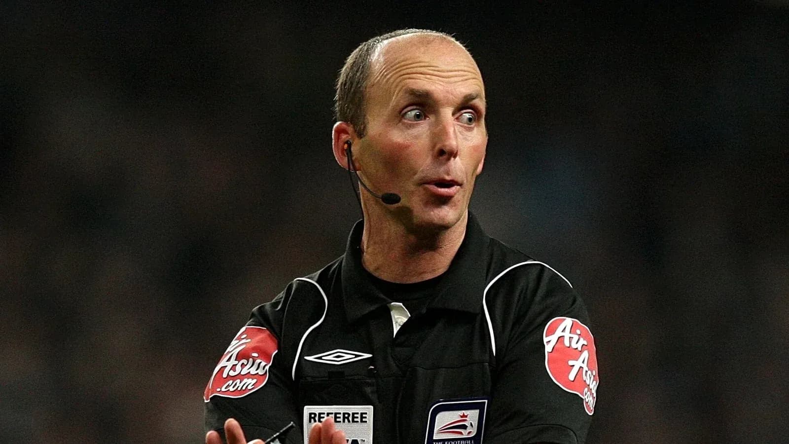 Referee communicating during a football match Referee communicating during a football match