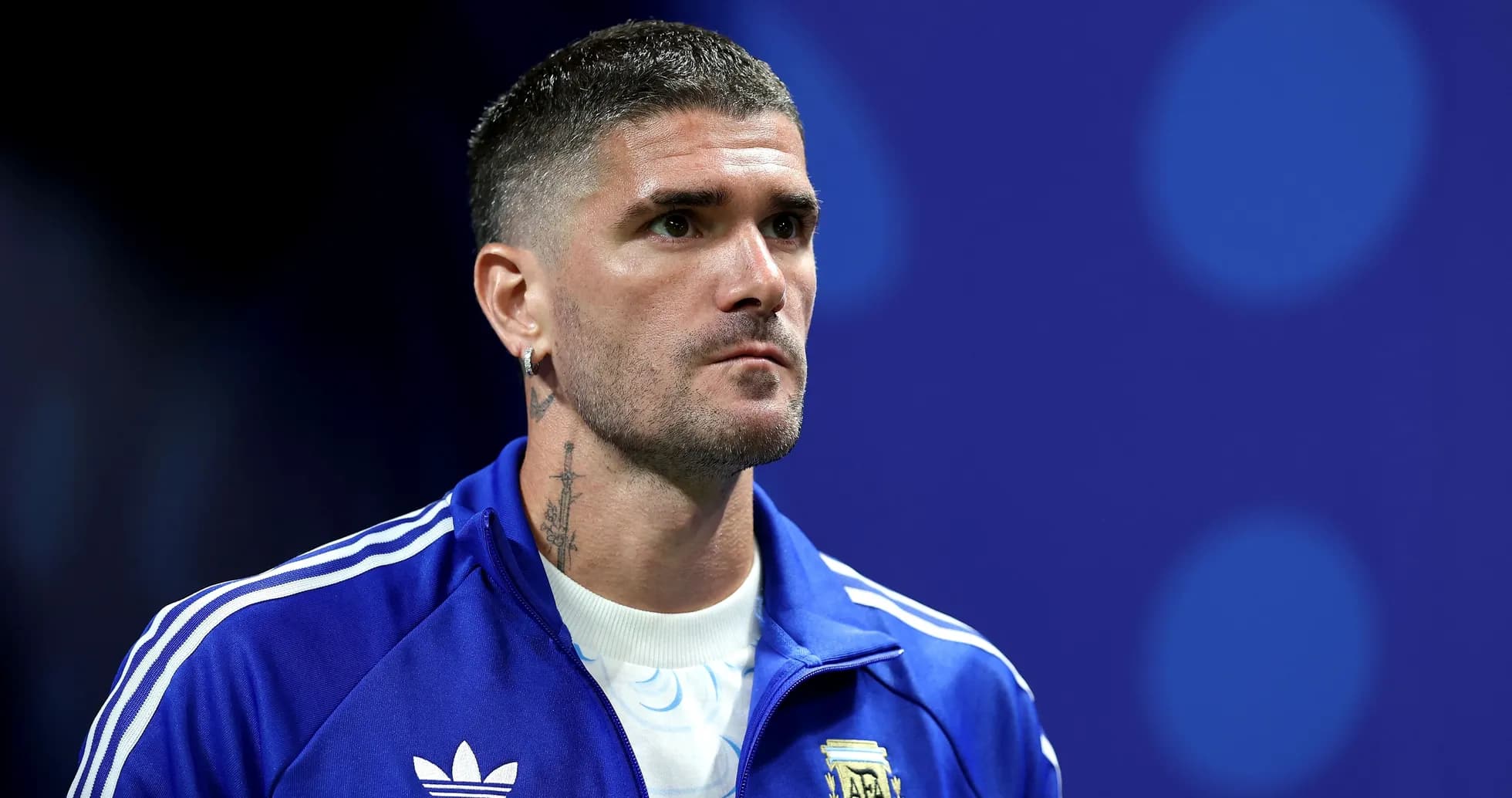 Player in blue tracksuit with Argentina emblem Player in blue tracksuit with Argentina emblem