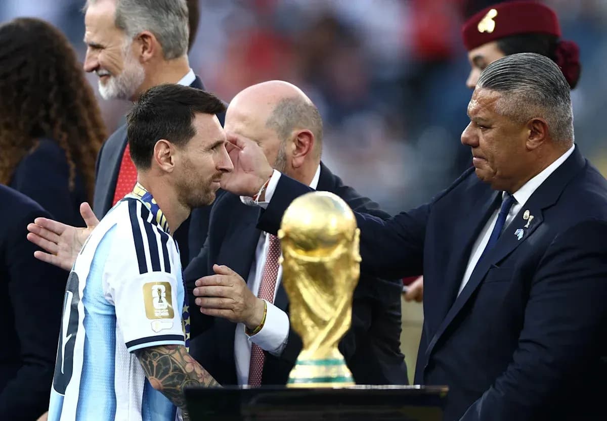 Lionel Messi receiving trophy during award ceremony Lionel Messi receiving trophy during award ceremony