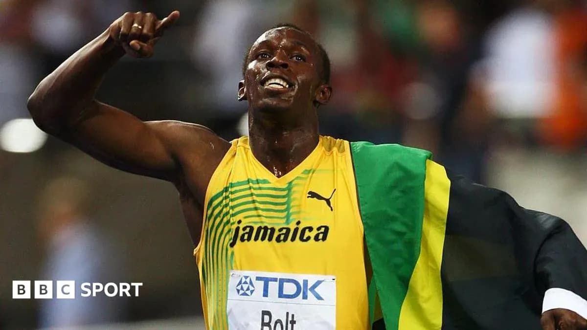 Usain Bolt celebrating victory with Jamaican flag Usain Bolt celebrating victory with Jamaican flag