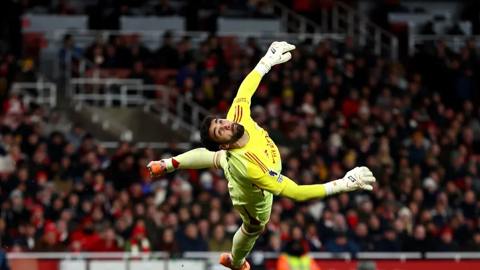Goalkeeper diving to make a save during match Goalkeeper diving to make a save during match