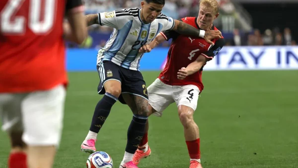 Argentinian player dribbling past Austrian defender Argentinian player dribbling past Austrian defender