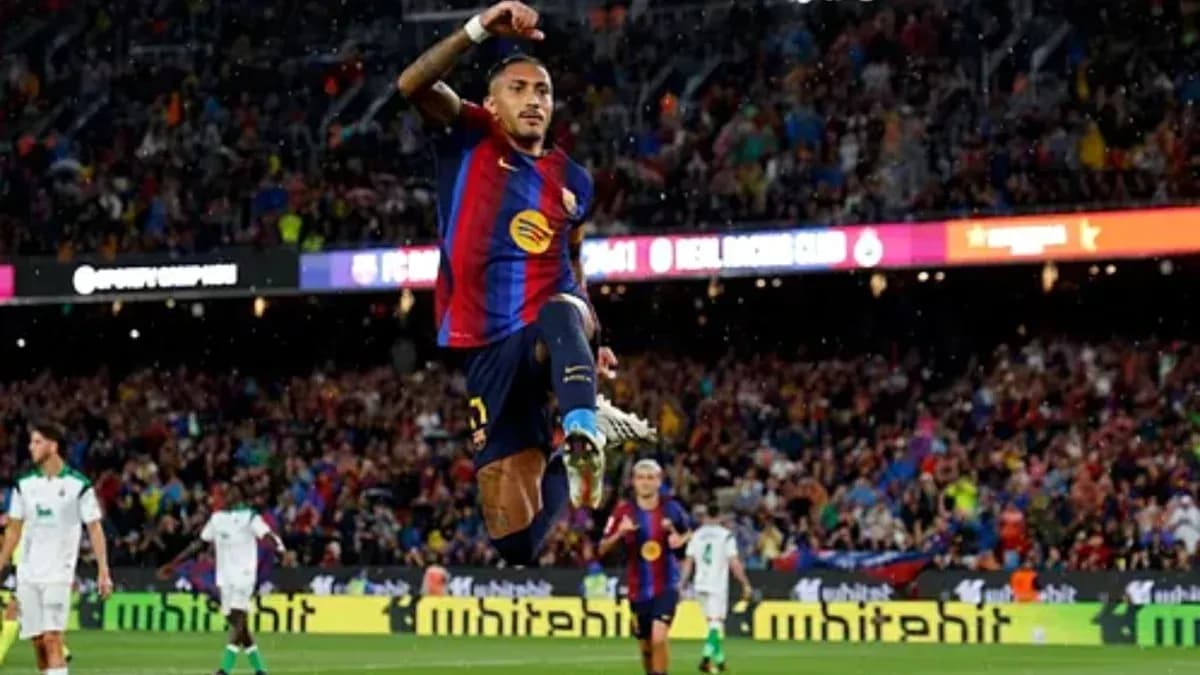 Player celebrating after scoring a goal for Barcelona Player celebrating after scoring a goal for Barcelona