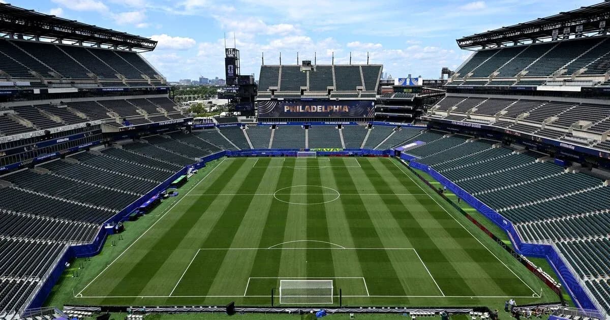 Empty stadium with soccer field and seats Empty stadium with soccer field and seats