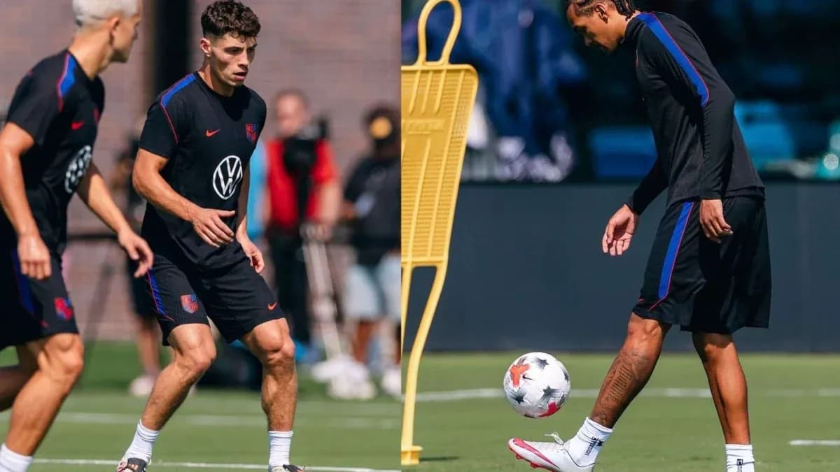 Two players training on the field with a soccer ball Two players training on the field with a soccer ball