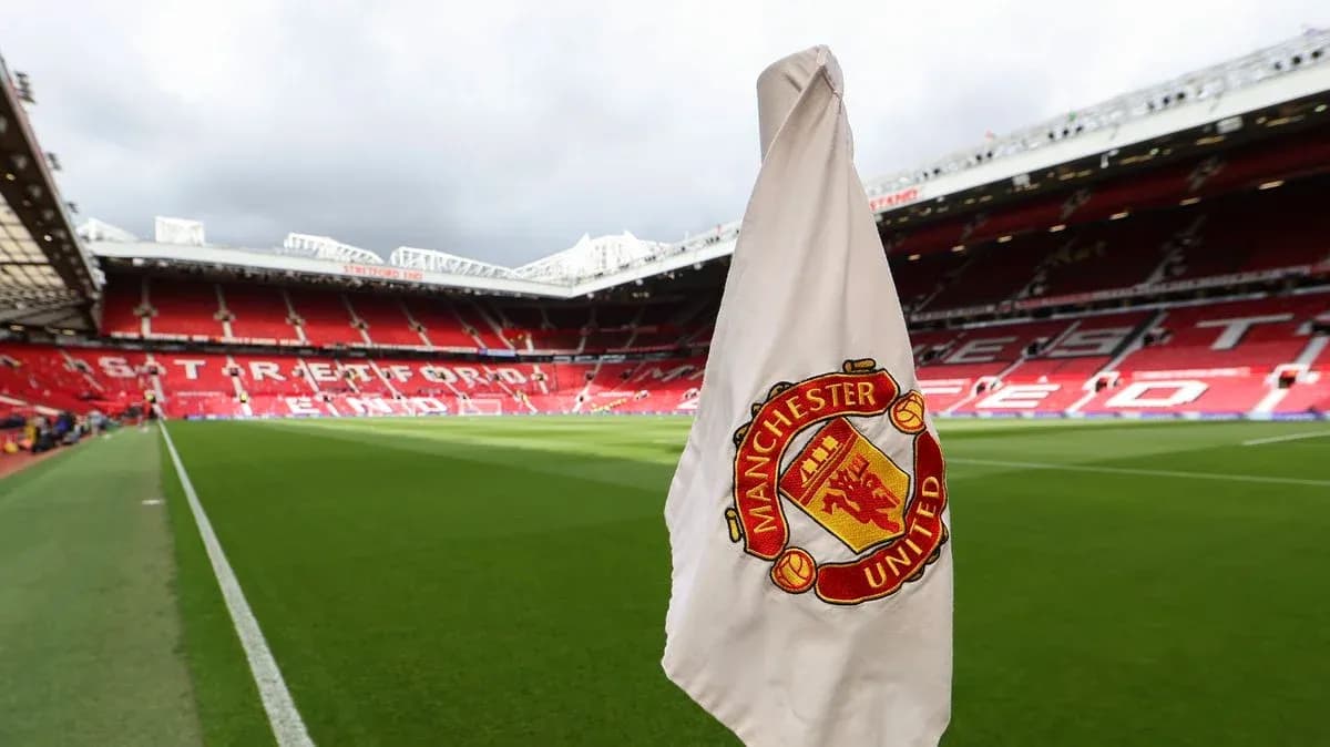 Corner flag with Manchester United emblem at stadium Corner flag with Manchester United emblem at stadium
