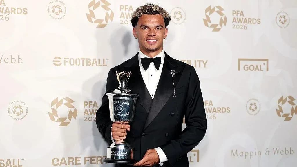 Player holding award at PFA Awards ceremony Player holding award at PFA Awards ceremony