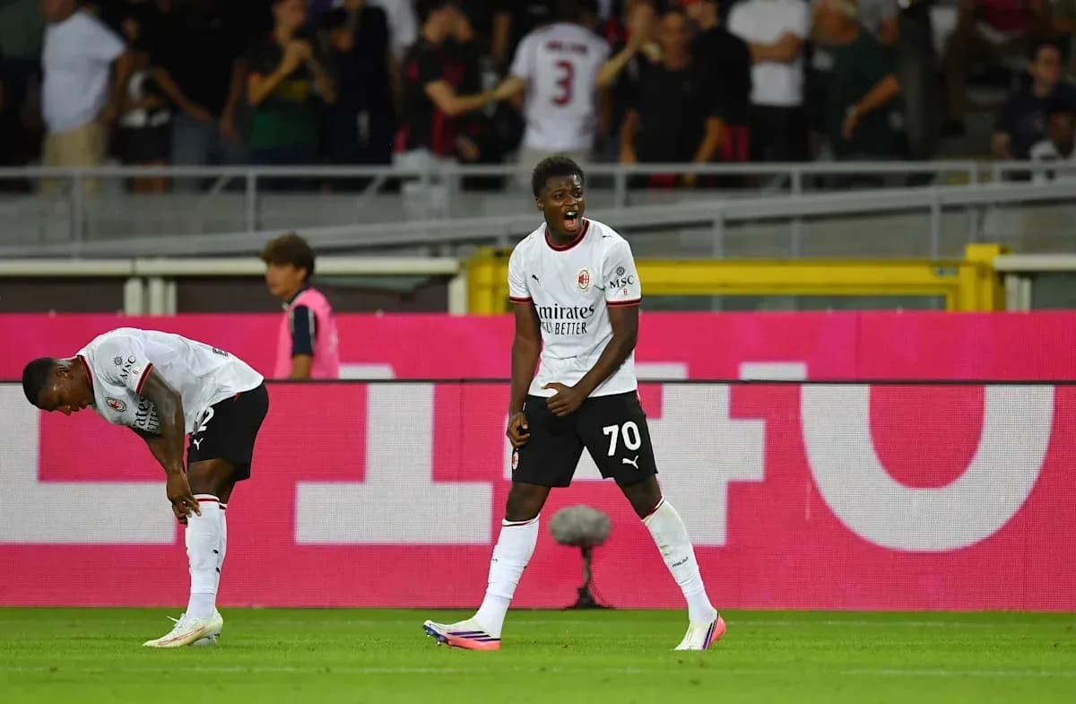 AC Milan players celebrating during a match AC Milan players celebrating during a match