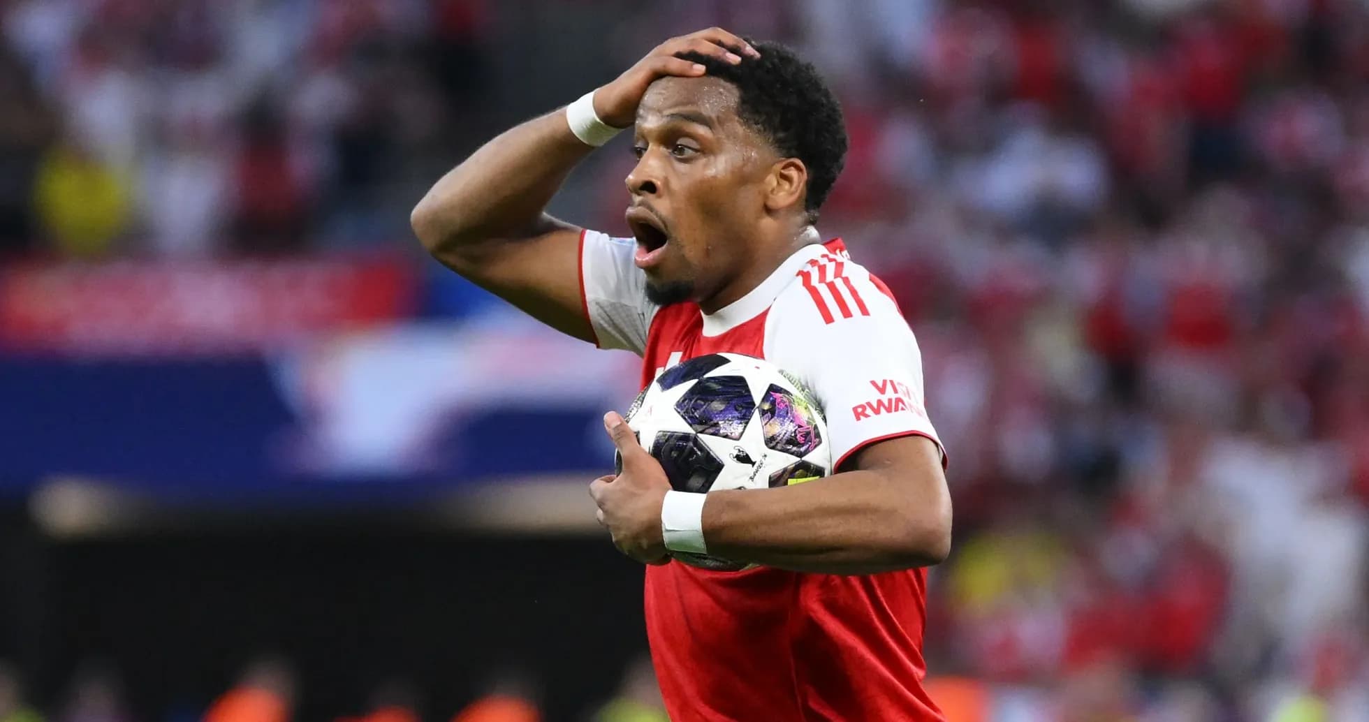 Player holding the ball with a surprised expression Player holding the ball with a surprised expression