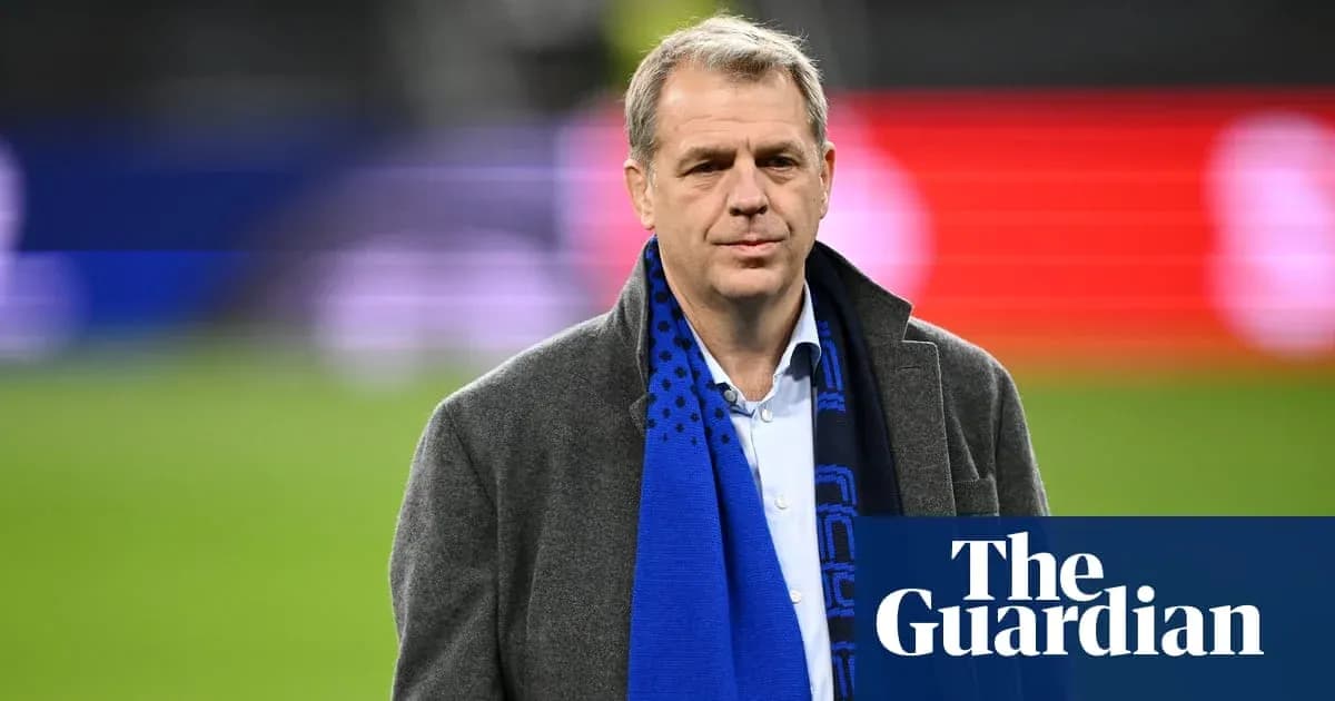 Man wearing a coat and scarf on the field Man wearing a coat and scarf on the field